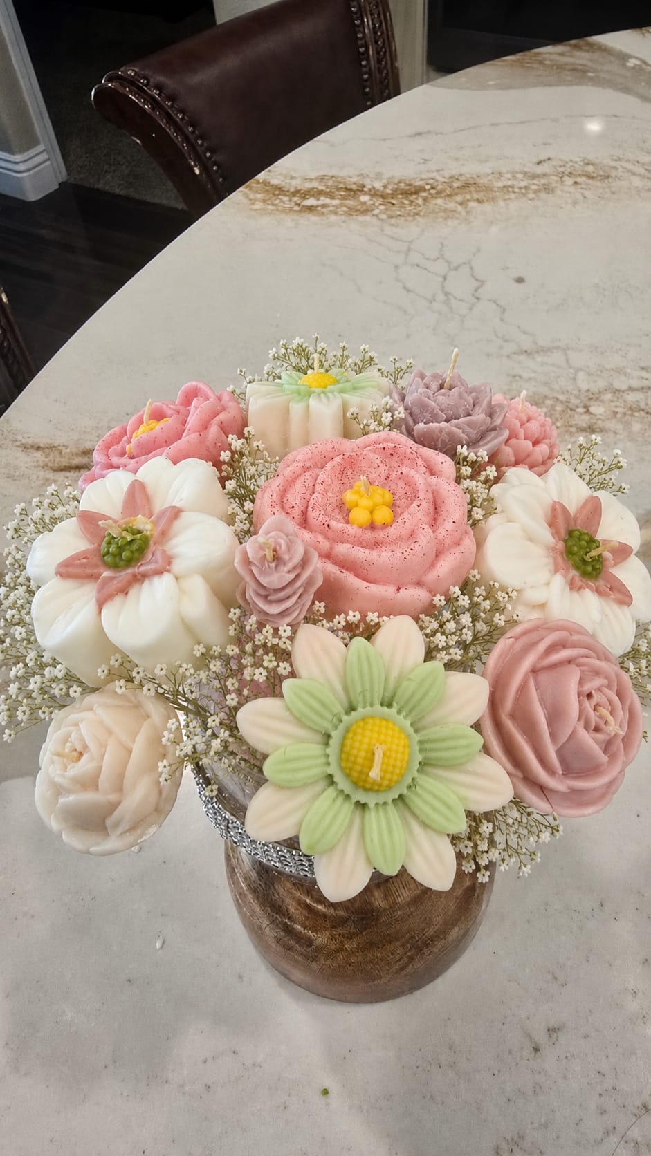 Bouquet of pink, cream, green, and lavender floral candles